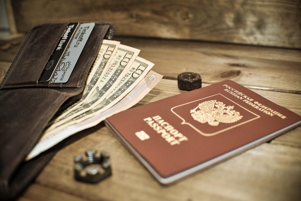Passport with US dollars and wallet, symbolizing currency exchange and travel budgeting
