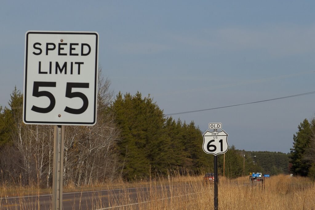 Speed limit sign showing miles per hour on road