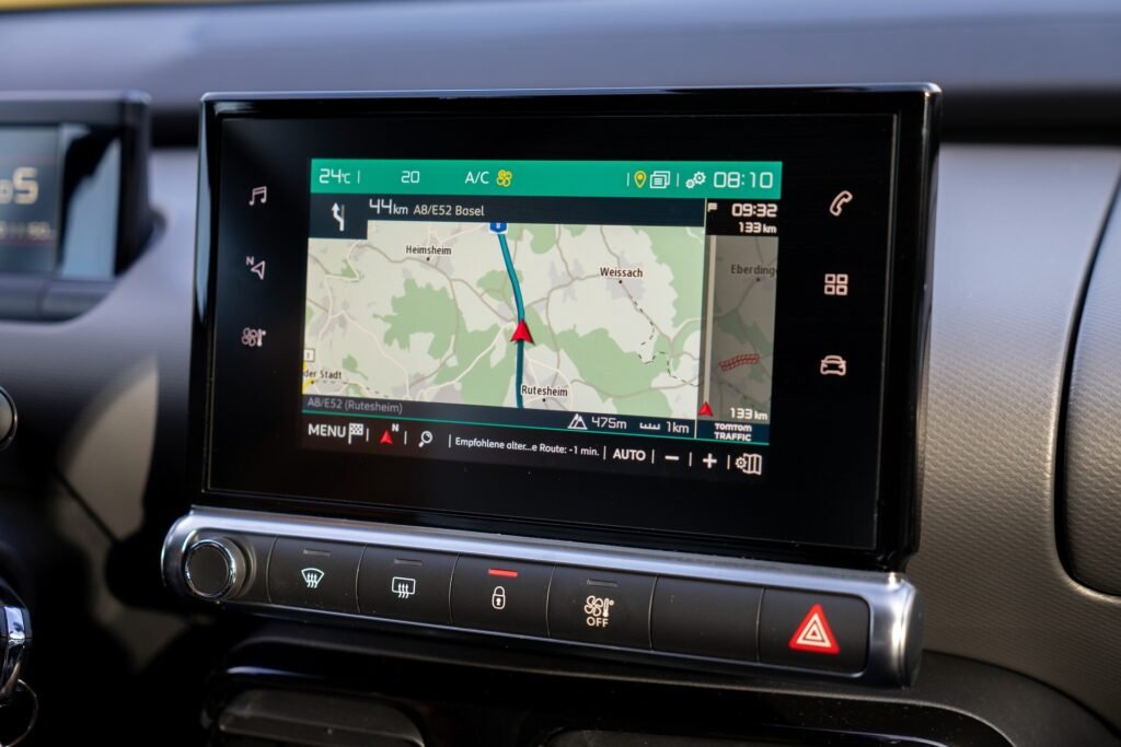 Car GPS displaying kilometers used in miles to kilometers conversion example